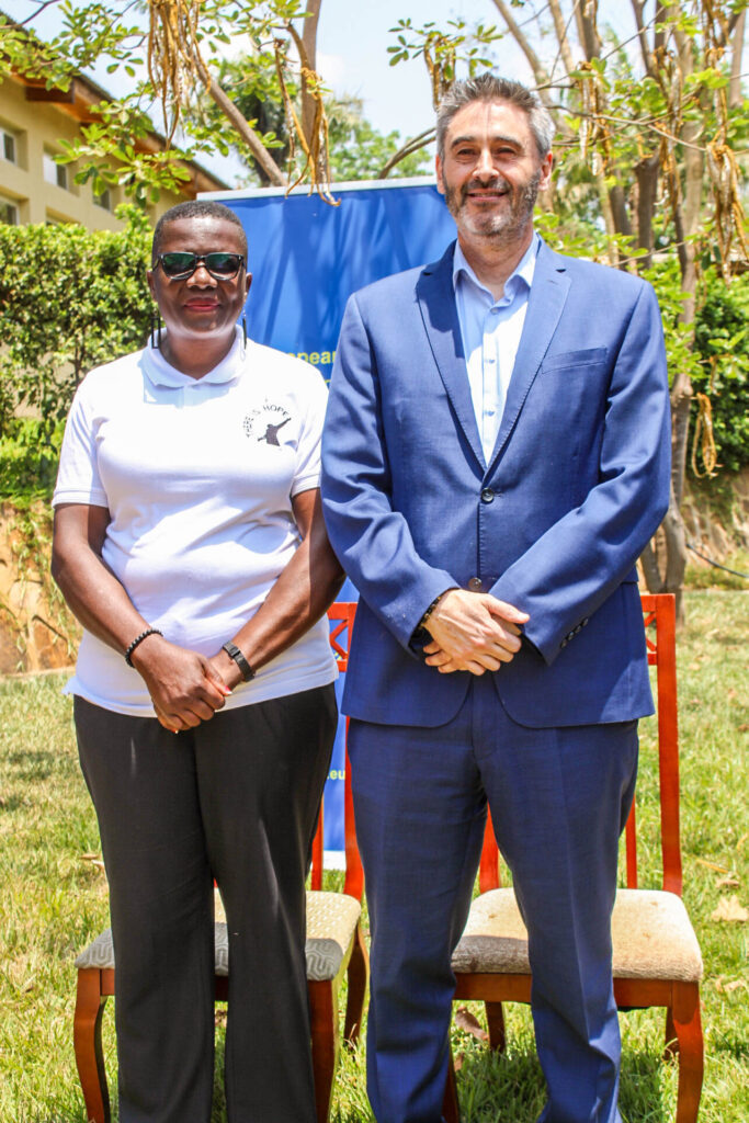 EU Ambassador to Malawi, Daniel Aristi-Gaztelumendi pose with Cathreen Ndege-Chirwa of There is Hope.
